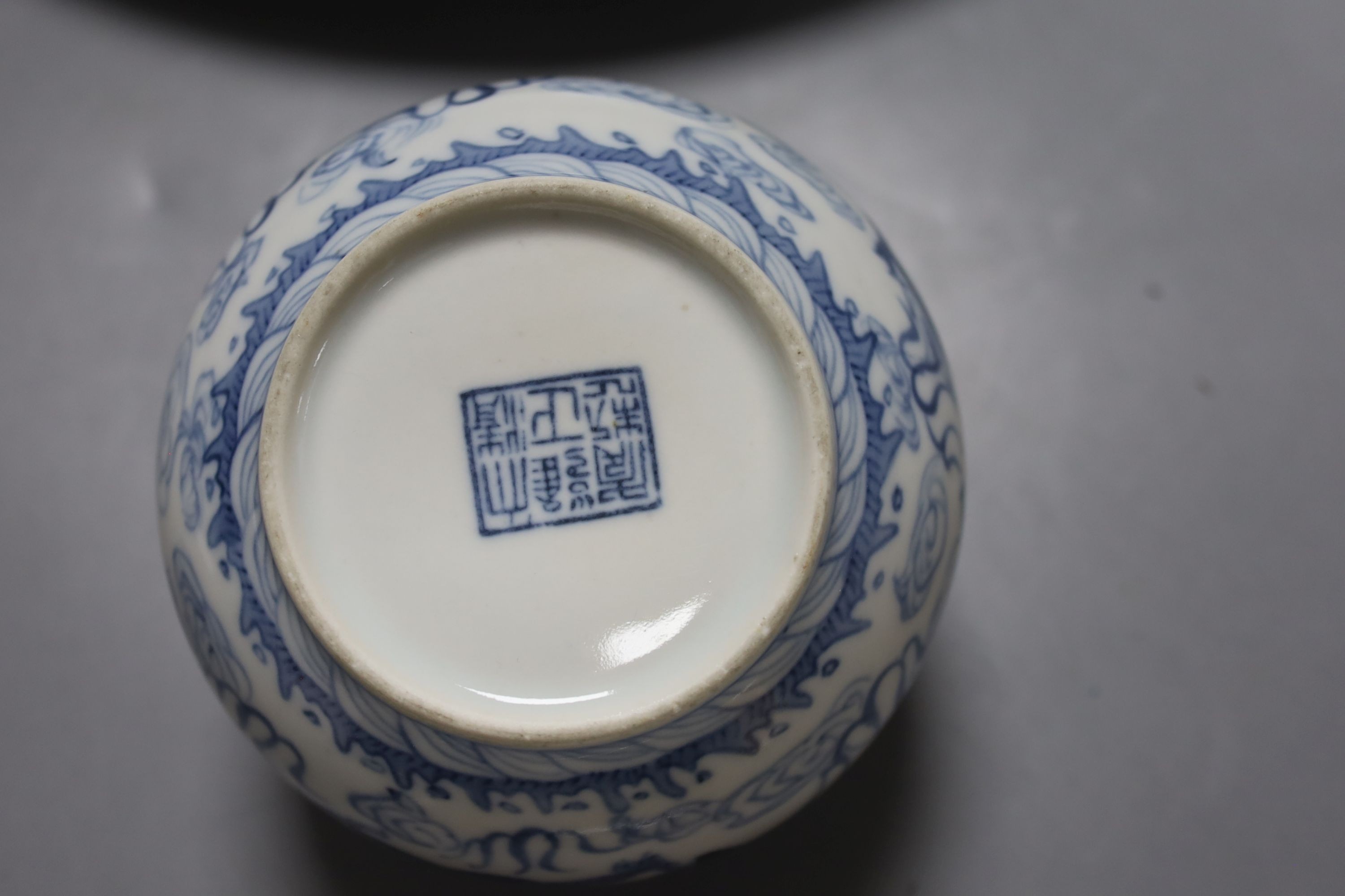 Two 18th century Chinese blue and white dishes and a water pot, largest item 34.5 cms diameter.